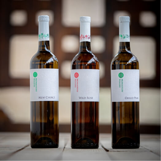 three white wine bottles