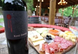 wine of red bottle and a charcuterie